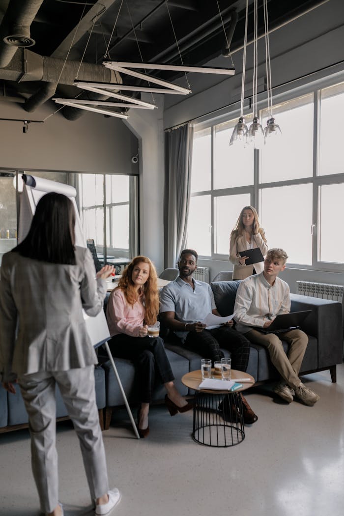 Offerings A team of professionals engaged in a business meeting in a modern office setting.